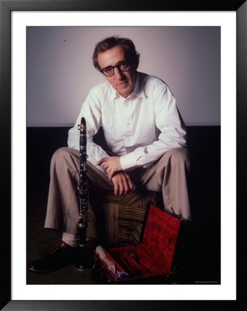 Filmmaker Woody Allen Sitting On Sofa With His Clarinet And An Open Clarinet Case At His Feet by Ted Thai Pricing Limited Edition Print image