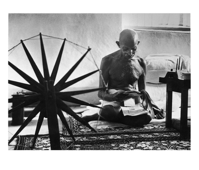 Indian Leader Mohandas Gandhi Reading As He Sits Cross Legged On Floor by Margaret Bourke-White Pricing Limited Edition Print image