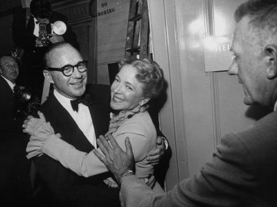 Actor Jack Benny Hugging Actress Helen Hayes At The Opening Of The New Huntington Hartford Theater by Loomis Dean Pricing Limited Edition Print image