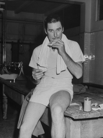 Errol Flynn Removing Cigarette From Pack On Day Of Tennis Match With Bill Tilden by Bernard Hoffman Pricing Limited Edition Print image