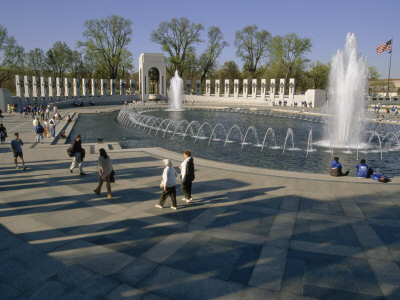 Visitors Enjoy The Fountains And Columns Of The World War Ii Memorial by Stephen St. John Pricing Limited Edition Print image