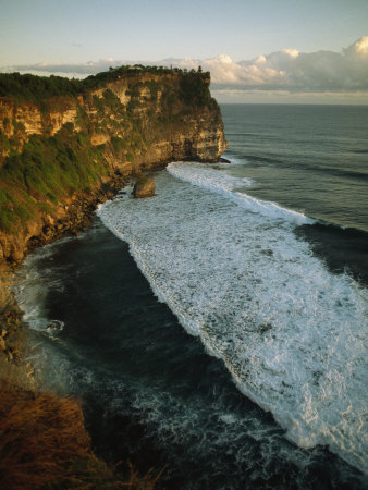 Elevated View Of The Sea Cliffs At Ulu Watu by Tim Laman Pricing Limited Edition Print image