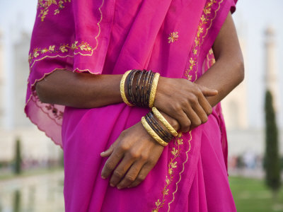 Indian Woman's Bracelets Against Brightly Colored Sari by Scott Stulberg Pricing Limited Edition Print image