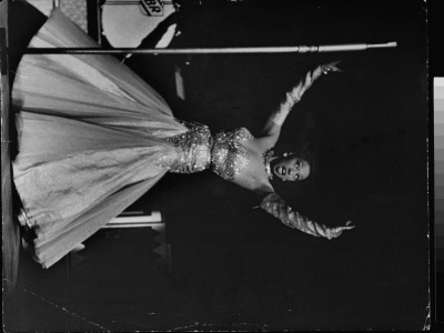Nightclub Singer Josephine Baker Singing Brazilian Native Song On Stage At Strand Movie Theater by Alfred Eisenstaedt Pricing Limited Edition Print image