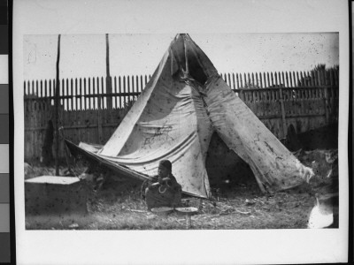 An Indian Child Sitting Outside A Teepee On The Grounds Of Buffalo Bill's Wild West Show by Wallace G. Levison Pricing Limited Edition Print image