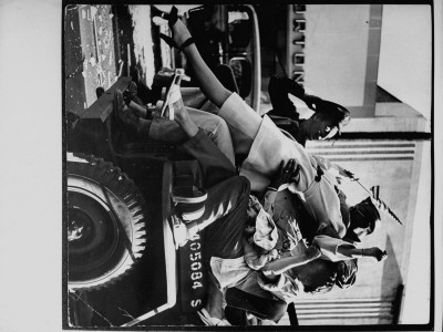 Jubilant Soldier Passionately Kissing Suit-Clad, Flag-Waving, Female During Celebration by Walter Sanders Pricing Limited Edition Print image