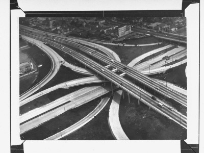 At The Hub Of The Freeway System, Including The Hollywood Freeway And The Harbor Freeway by J. R. Eyerman Pricing Limited Edition Print image
