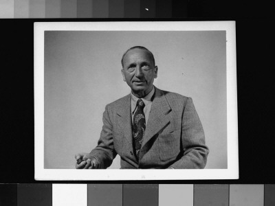 Director Michael Curtiz Holding Shutter Release As He Takes His Own Photograph by Gjon Mili Pricing Limited Edition Print image