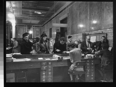 People Lined Up At Desk In Circulation Room In The New York Public Library by Alfred Eisenstaedt Pricing Limited Edition Print image