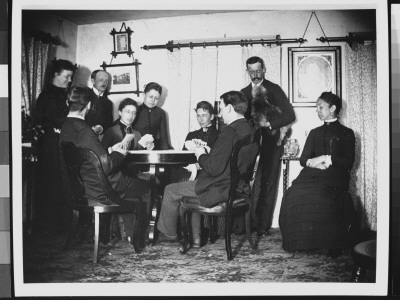 Four People Playing A Bridge Game At The Goldings As Others Look On by Wallace G. Levison Pricing Limited Edition Print image