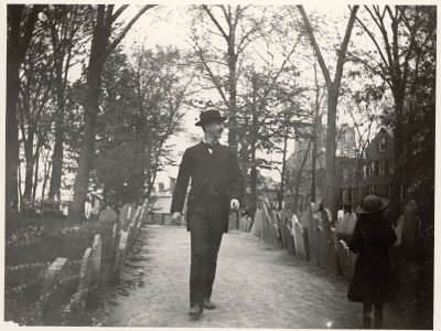 Nathan Abbott And A Young Girl Walking Through Copps Hill Cemetery by Wallace G. Levison Pricing Limited Edition Print image