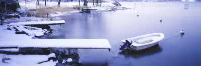 High Angle View Of A Motorboat Moored In A Lake by Staffan Brundell Pricing Limited Edition Print image