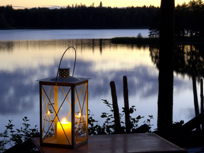 A Lantern By A Still Lake At Dusk by Berndt-Joel Gunnarsson Pricing Limited Edition Print image
