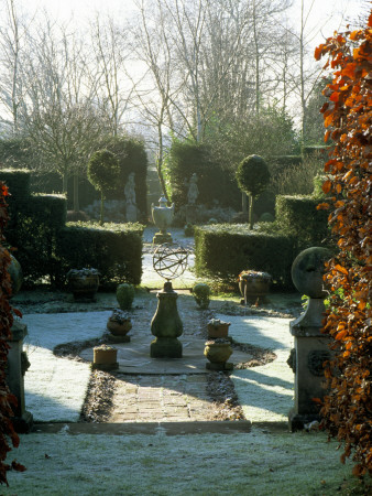 Symmetrical Garden In Frost With Armillary Sphere And Beech Hedges, Designer: Sir Roy Strong by Clive Nichols Pricing Limited Edition Print image