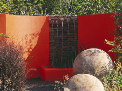 Merger Garden Designed By Andrew Duff: Orange Wall, Water Feature, Spheres Cut From Stumps; Chelsea by Clive Nichols Pricing Limited Edition Print image