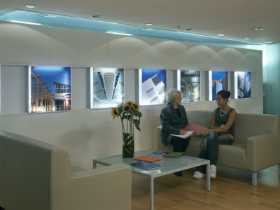 Office Life And Interiors, Two Women In Reception Area by Nicholas Kane Pricing Limited Edition Print image