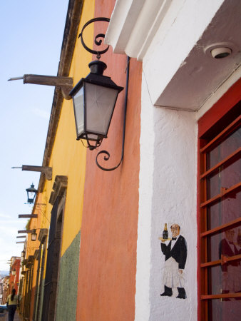 Restaurant And Colorful Shops, San Miguel De Allende, Guanajuato State, Mexico by Julie Eggers Pricing Limited Edition Print image