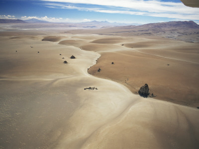 Barren Landscape And A Solitary Dirt Road Through The Altiplano At 4500M, Bolivia, South America by Doug Allan Pricing Limited Edition Print image