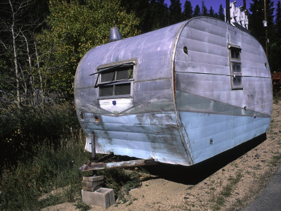 Old Camper At A Car Cemetery In Colorado by Michael Brown Pricing Limited Edition Print image