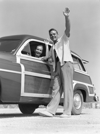 Smiling Couple Waving From A 1949 Mercury Station Wagon by H. Armstrong Roberts Pricing Limited Edition Print image
