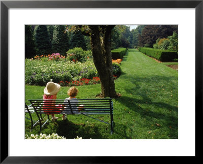 Little Girls On Bench In Garden, Oh by Jeff Greenberg Pricing Limited Edition Print image