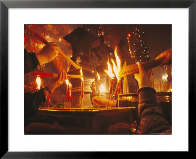 Buddhists Light Candles And Incense At The Man Mo Temple by Eightfish Pricing Limited Edition Print image