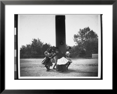 Children Holding Hands In A Circle As They Dance Around A Pole With Their Backs To It by Wallace G. Levison Pricing Limited Edition Print image
