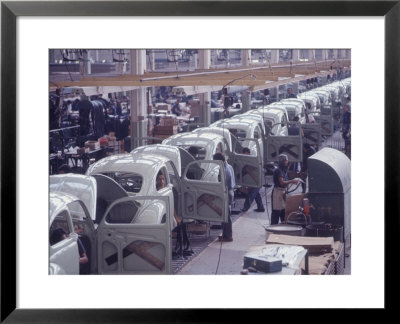 White Volkswagens Coming Down Assembly Line In Brazilian Factory by Paul Schutzer Pricing Limited Edition Print image