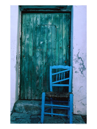 Chair In Front Of A Green Door In The Village Of Caceres, Caceres, Extremadura, Spain by Jeffrey Becom Pricing Limited Edition Print image