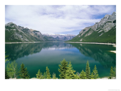 The Palliser Range Is Reflected In Lake Minnewanka by Rich Reid Pricing Limited Edition Print image