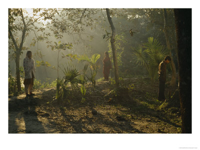 A Man And His Sisters Warm Themselves In Rays Of The Winter Sun by Eightfish Pricing Limited Edition Print image