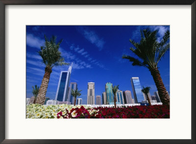 Skyline With Flowers In Foreground, Shiek Zayed Rd, Dubai, United Arab Emirates by Phil Weymouth Pricing Limited Edition Print image