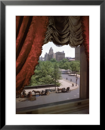 View Of Handsome Cab Horse Drawn Carriages Outside The Plaza Hotel by Dmitri Kessel Pricing Limited Edition Print image