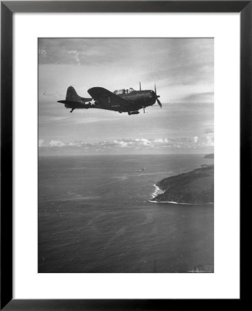 F-6 Hellcat Fighter Plane Over Tanahmera Bay As Japanese Airfields At Hollandia, New Guinea by J. R. Eyerman Pricing Limited Edition Print image