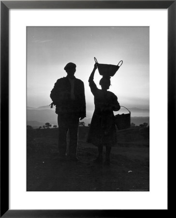 Farm Couple Returning From A Day's Work As Woman Carries Turkey Chicks In Bucket Balanced On Head by Alfred Eisenstaedt Pricing Limited Edition Print image