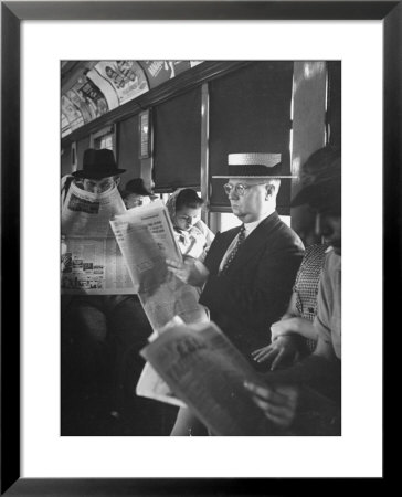 Commuters Sitting On A Train And Reading The Chicago Tribune by Charles E. Steinheimer Pricing Limited Edition Print image