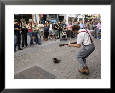 Busker Entertaining The Crowds, Galway, County Galway, Connacht, Republic Of Ireland by Gary Cook Pricing Limited Edition Print image