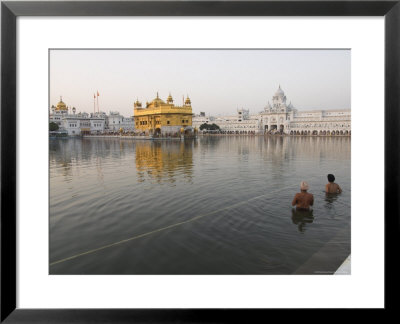 Two Sikh Pilgrims Bathing And Praying In The Early Morning In Holy Pool, Amritsar, India by Eitan Simanor Pricing Limited Edition Print image