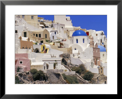 Village Of Oia With Blue Churches And Colourful Dwellings, Oia, Santorini (Thira), Greece by Marco Simoni Pricing Limited Edition Print image
