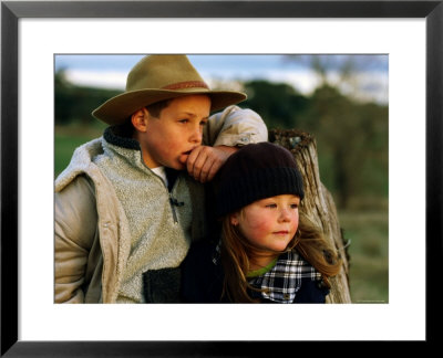 Young Farm Boy And Girl Leaning Against A Fence Post, Hamilton, Victoria, Australia by Daniel Boag Pricing Limited Edition Print image