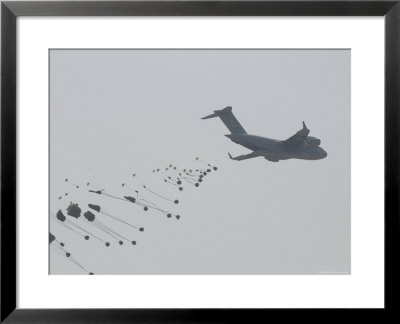 Paratrooper Supplies Deployed From The Back Of C-140 Cargo Plane by Skip Brown Pricing Limited Edition Print image