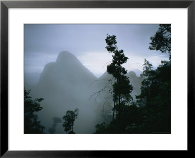 Peak Of Gunung Budda Through Early Morning Fog by Stephen Alvarez Pricing Limited Edition Print image
