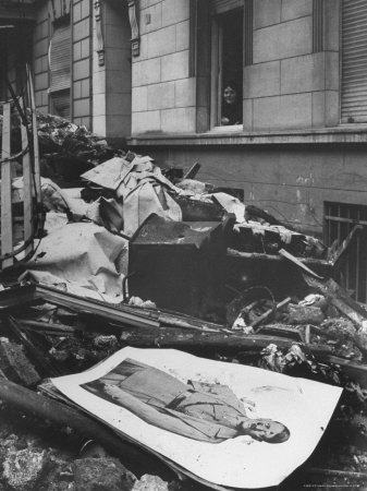 View Of A Poster Of Nazi Leader Adolf Hitler On The Rubble Of A Bombed Out Building by Margaret Bourke-White Pricing Limited Edition Print image