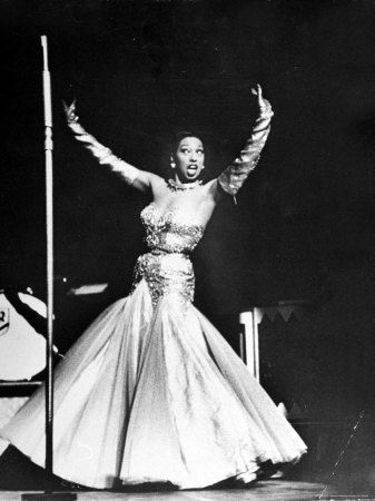 Nightclub Singer Josephine Baker Singing Brazilian Native Song On Stage At The Strand Movie Theater by Alfred Eisenstaedt Pricing Limited Edition Print image