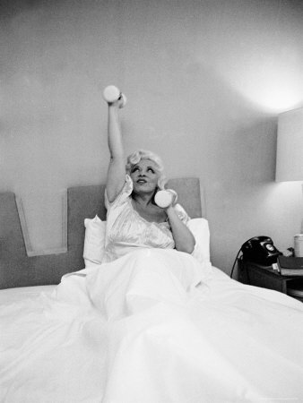 Entertainer Mae West Lifting Barbells In Bed by Loomis Dean Pricing Limited Edition Print image