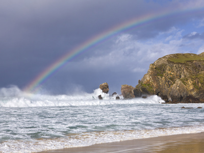 Sea Stacks, Rainbow, Stormy Clouds And Rough Seas On A Windy Afternoon At Dalmore Bay On The Isle O by Lizzie Shepherd Pricing Limited Edition Print image