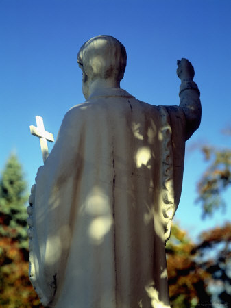 Statue Holding The Cross Of The Catholic Church by John Coletti Pricing Limited Edition Print image