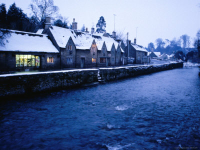 Buildings In Cotswolds Village On Winter Night, Bibury, Gloucestershire, England by Jon Davison Pricing Limited Edition Print image