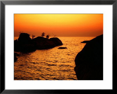 Rocks And Coastline At Otter Point, Cape Maclear, Malawi by David Wall Pricing Limited Edition Print image
