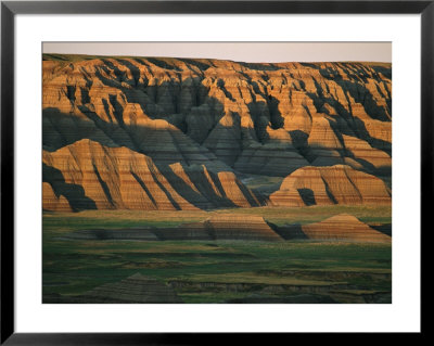 Sunset On The Eroded Land Formations Of The Badlands by Annie Griffiths Belt Pricing Limited Edition Print image